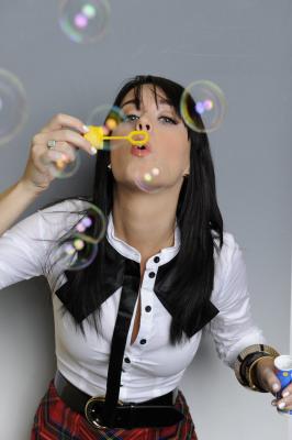 Katy Perry blowing bubbles