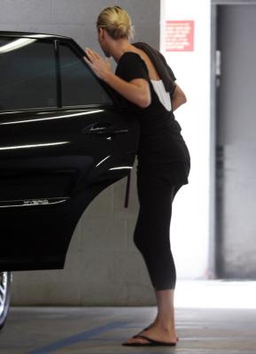 Charlize Theron getting in a car