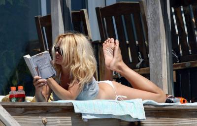 Pamela Anderson reading a book