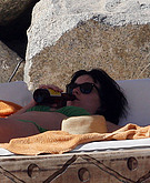 Katy Perry drinking on the beach