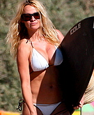 Pamela Anderson wtih surf board