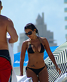 Vida Guerra with some guy on the beach