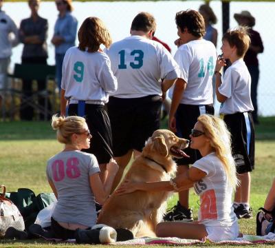 Pamela Anderson getting licked by dog