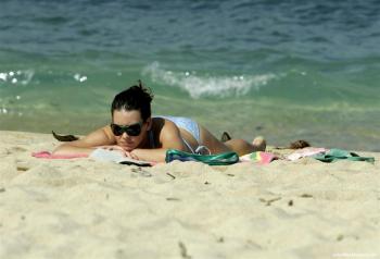 Evangeline Lilly sunbathing